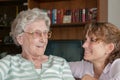 Portrait of young woman smiling at her grandmother Royalty Free Stock Photo