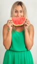 Portrait of a young woman smiling with water melon