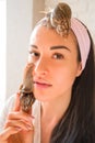 Portrait of young woman with snails on her face Royalty Free Stock Photo