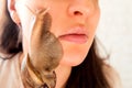 Portrait of young woman with snails on her face Royalty Free Stock Photo