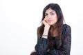 Portrait of young woman standing hand on chin against white  background with copy space Royalty Free Stock Photo