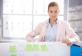 Portrait of young woman standing in office Royalty Free Stock Photo