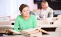 Portrait of young woman studying Royalty Free Stock Photo