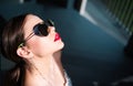 Portrait of a young woman in sunglasses. Close-up portrait of a beautiful charming young attractive lady. Young woman Royalty Free Stock Photo