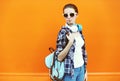 Portrait of young woman in sunglasses with headphones Royalty Free Stock Photo