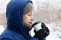 Portrait of a young woman surrounded by flying snowflakes Royalty Free Stock Photo