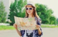 Portrait young woman tourist sightseeing city with paper map Royalty Free Stock Photo