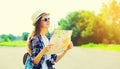 Portrait of young woman tourist sightseeing city with paper map Royalty Free Stock Photo