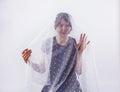 Portrait of young woman under white veil. Feelings, excitement,