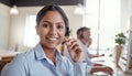 Youve called the right place. Portrait of a young woman using a headset in a modern office.