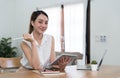 Portrait of Young woman using laptop computer at the office, Student girl working at home. Work or study from home Royalty Free Stock Photo