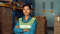 Portrait of young woman warehouse worker smiling in the storehouse Royalty Free Stock Photo