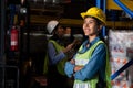 Portrait of young woman warehouse worker smiling in the storehouse Royalty Free Stock Photo