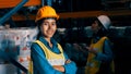 Portrait of young woman warehouse worker smiling in the storehouse Royalty Free Stock Photo