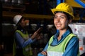 Portrait of young woman warehouse worker smiling in the storehouse Royalty Free Stock Photo