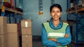 Portrait of young woman warehouse worker smiling in the storehouse Royalty Free Stock Photo