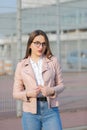 Woman wearing glasses laughing in the fall. Cheerful woman in the street Royalty Free Stock Photo