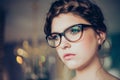 Portrait of young woman wearing glasses