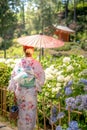 Portrait of a young woman wearing Japanese yukata summer kimono. Kyoto, Japan.