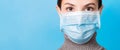 Portrait of young woman wearing medical mask at blue background. Protect your health. concept