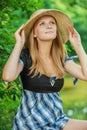 Portrait of young woman wearing straw hat