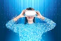 Smiling woman in vr glasses pixelated, blue