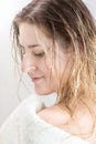 Closeup portrait of young woman with wet long hair covering in towel after having shower Royalty Free Stock Photo