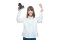 Portrait of a young woman in a white shirt holding a camera and Russian money rubles in her hand. The concept of a Royalty Free Stock Photo