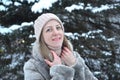 Portrait of a young woman in a winter forest