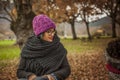 Portrait young woman with wool purple hat.