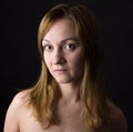 Portrait of young woman on yelllow cole field background