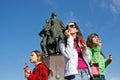 Portrait of young women blowing soap bubbles on the background of the fountain on a flashmob in Volgograd