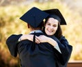 Youve been a great support to me. Portrait of a young woman hugging her friend on graduation day.