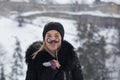 Portrait of young women with mustache paper props on snow day. H