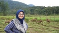 Portrait of young women in wildlife with deer