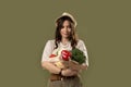 Portraite of Charming brunette woman in a beige t-shirt and a hat with cotton mesh eco bag full of fresh fruite and