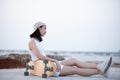 Portraits, Asian women lounging from skating and surfing on the beach at sunset