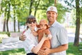 Portraits happy family. Young mother, father and their daughter of acute 10 months old baby girl. Walking on the Royalty Free Stock Photo