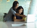 Kindly supervisor training new staff with laptop in modern office room