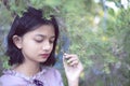 Portraits lonely young girl with pine tree background in vintage color