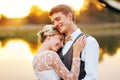 Portraits of a newly married couple. The wedding couple is standing on the background of the order. Royalty Free Stock Photo