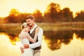 Portraits of a newly married couple. The wedding couple is standing on the background of the order.