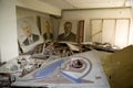 Portraits of politicians against the background of a ruined room in the town of Pripyat