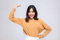 Portraits of young Asian women. Raise arms. With a smiling face happily, a beautiful woman with a sense of self-confidence, looks