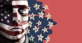 Portraiture of man with american flag face paint against hand drawn star pattern and red background Royalty Free Stock Photo