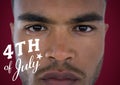 Portraiture of man with white fourth of July graphic against maroon background Royalty Free Stock Photo