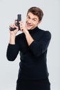Portrat of cheerful young man with gun