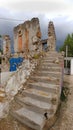 a portrayal of torn houses where only the other stairs are