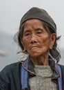 Portret Close up of Hmong elderly woman against gray skies.