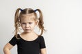portret emotional 4 year old girl with two ponytails